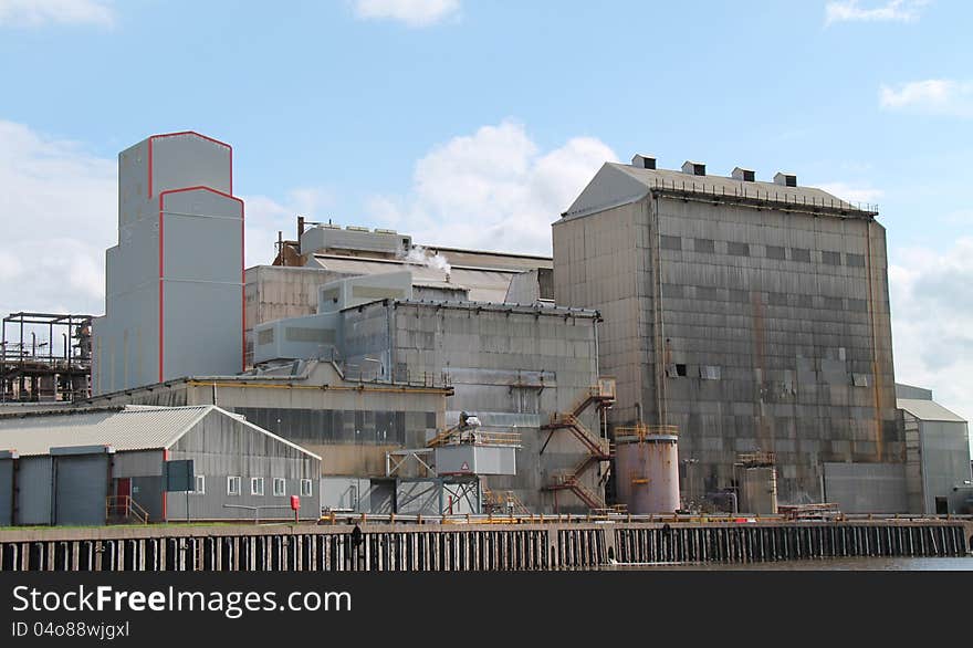 A Large Industrial Factory on a Riverbank. A Large Industrial Factory on a Riverbank.