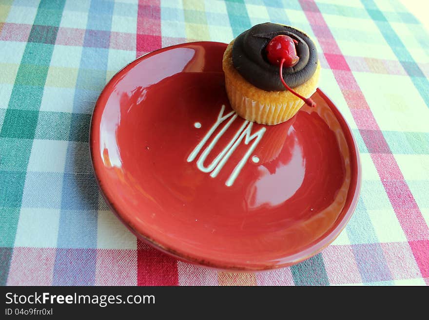 Colorful plate and cupcake