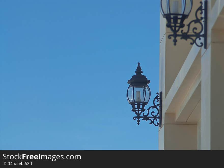 Outdoor wall lamp and blue sky