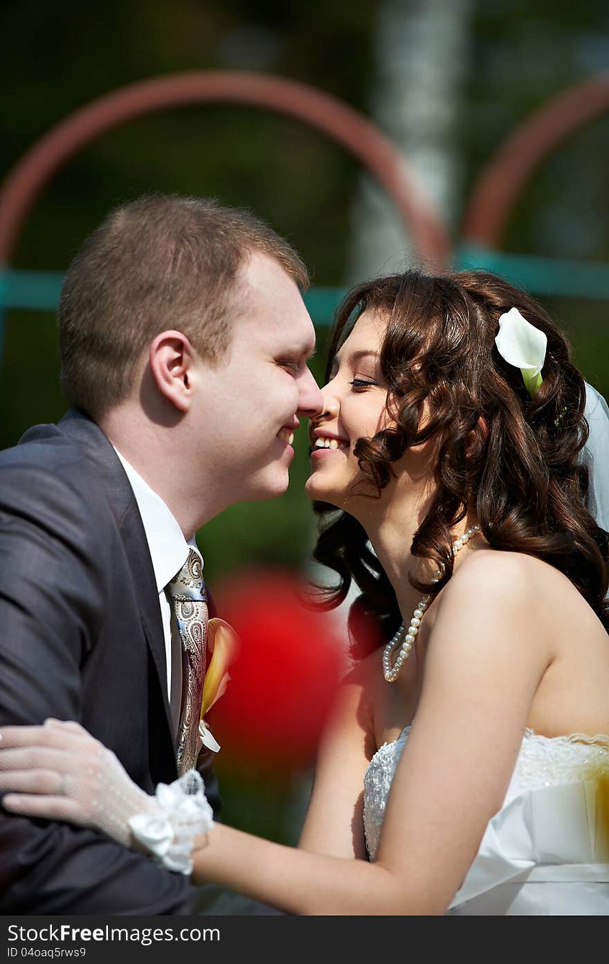 Happy groom and bride in wedding walk