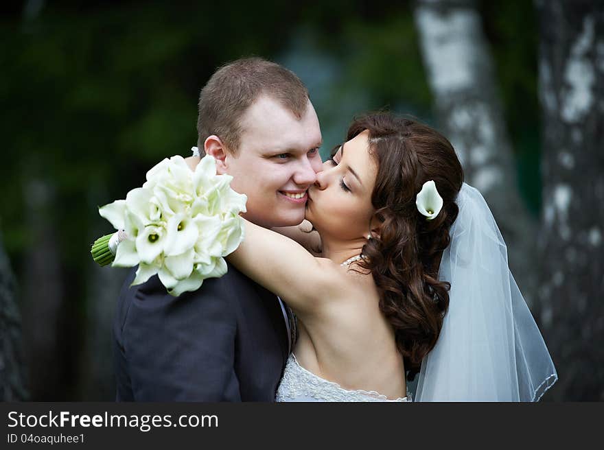 Kissing bride and groom