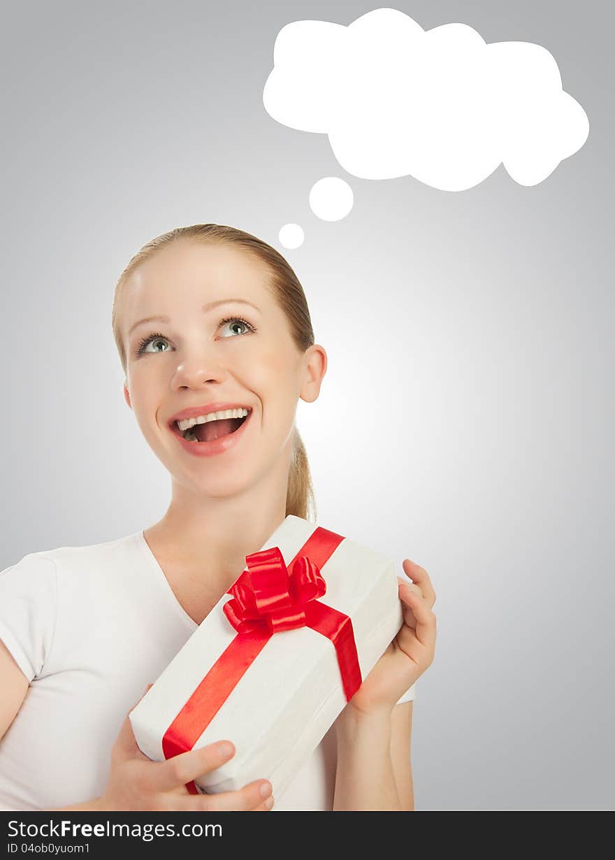 Beauty  cheerful girl with a Christmas gift