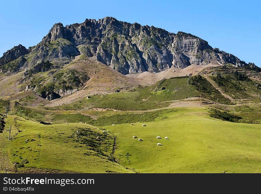 Beautiful landscape with green mountain meadows in the French Pyrenees. Beautiful landscape with green mountain meadows in the French Pyrenees