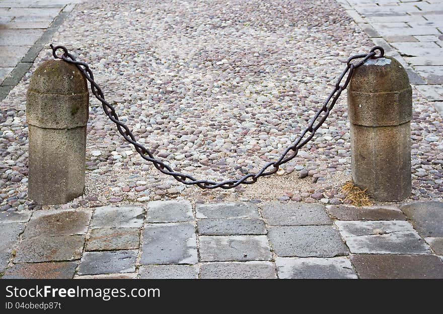 Stone columns with a chain