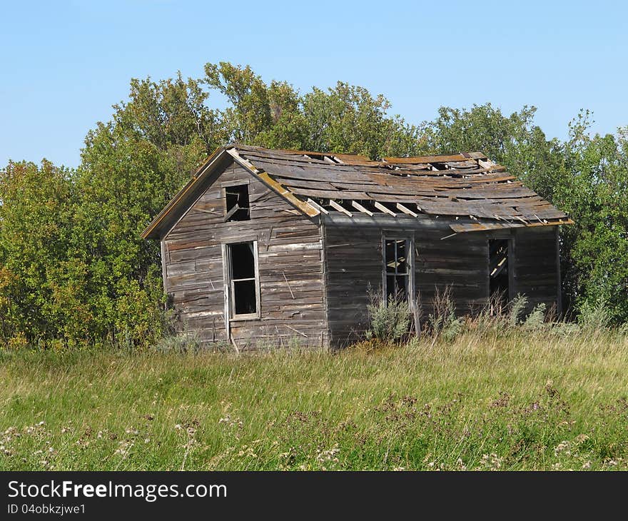 Old Rural Abandoned Wooden Collapsing House.