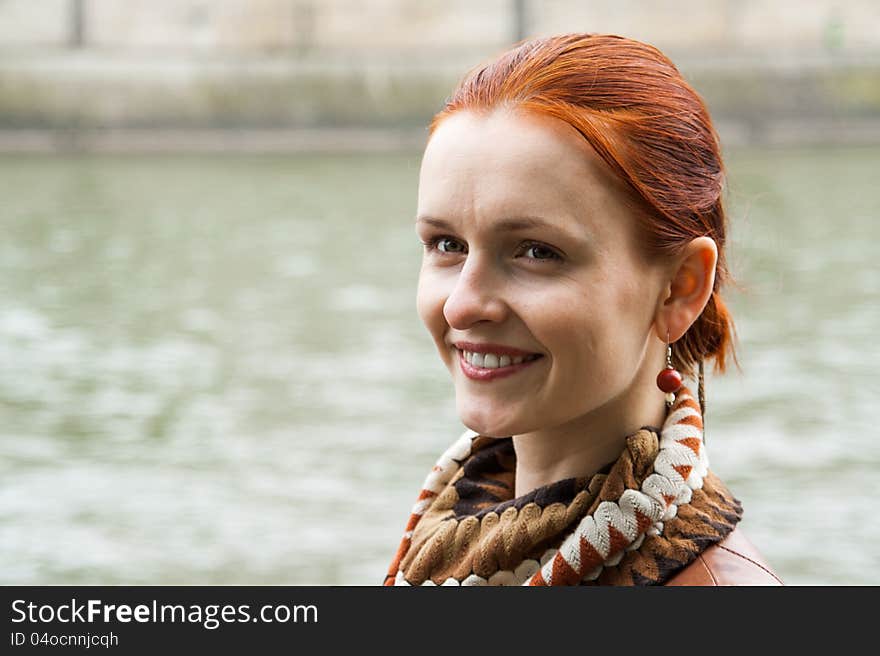 A woman smiling, with perfect teeth and red hair. A woman smiling, with perfect teeth and red hair.