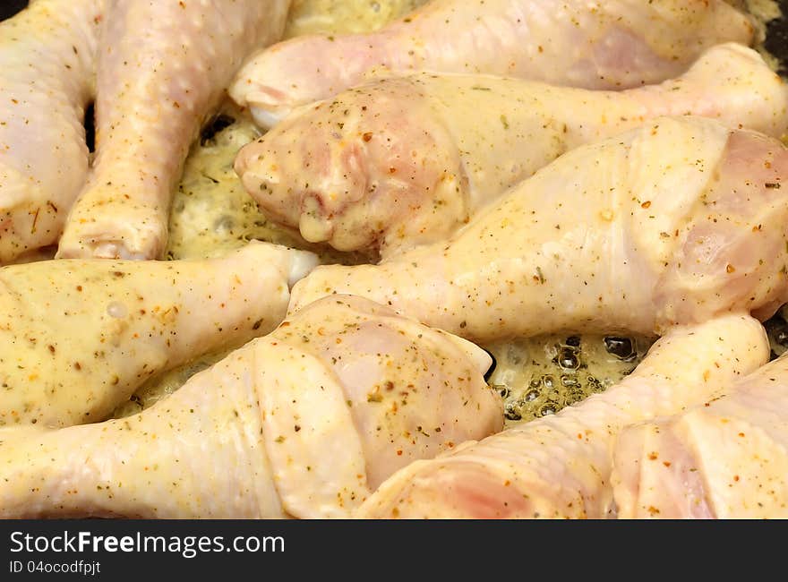 Leg of chicken fried on a frying pan. Leg of chicken fried on a frying pan