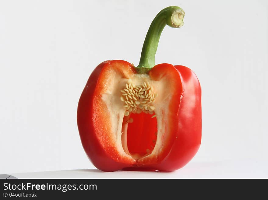 fresh red bell pepper, with countable seeds inside, also the cutting edge is very fresh and clear.  fresh red bell pepper, with countable seeds inside, also the cutting edge is very fresh and clear.