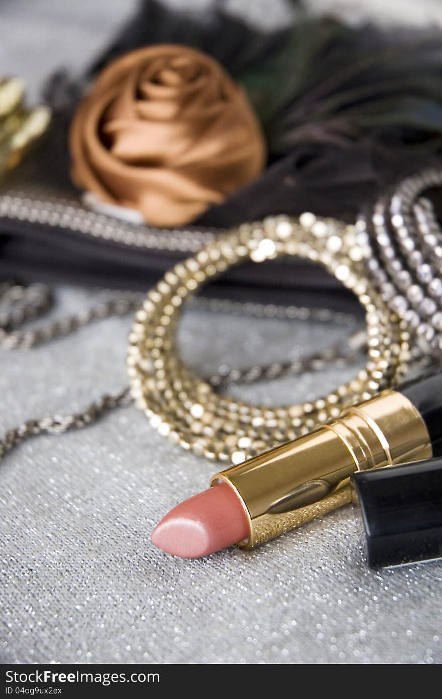 Pink lipstick and accessories background