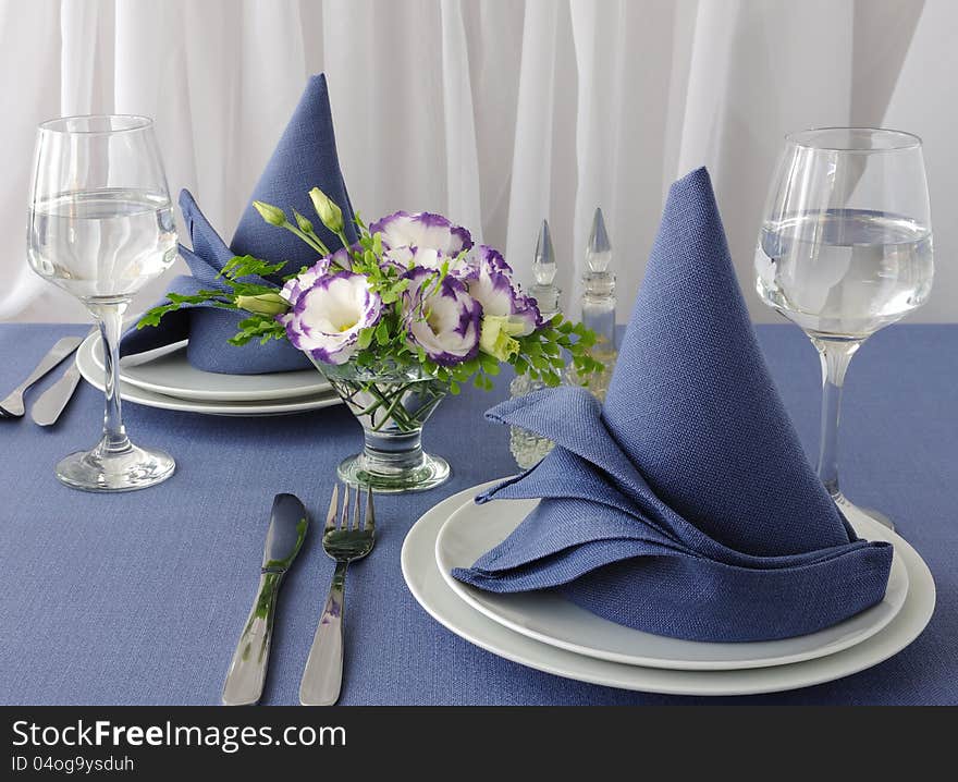 Fragment table setting with a decorative folded napkin