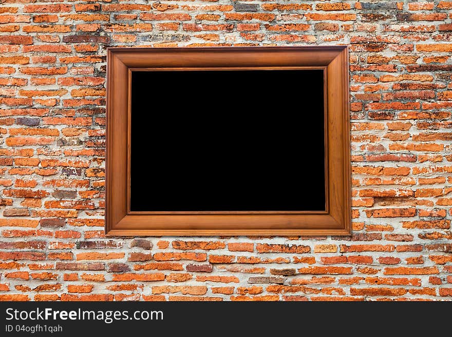 Wooden Photo Frame on Old brick wall