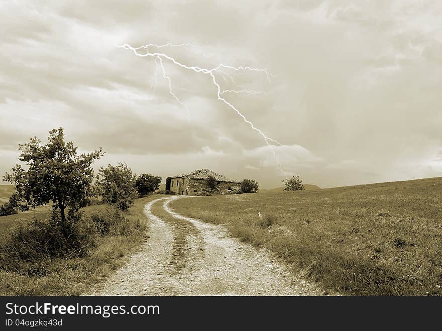 Cloudy sky over old house in countryside