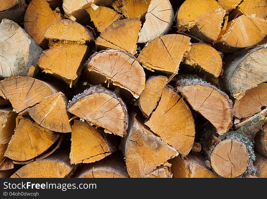 Dry chopped firewood logs in pile ready for winter. Dry chopped firewood logs in pile ready for winter