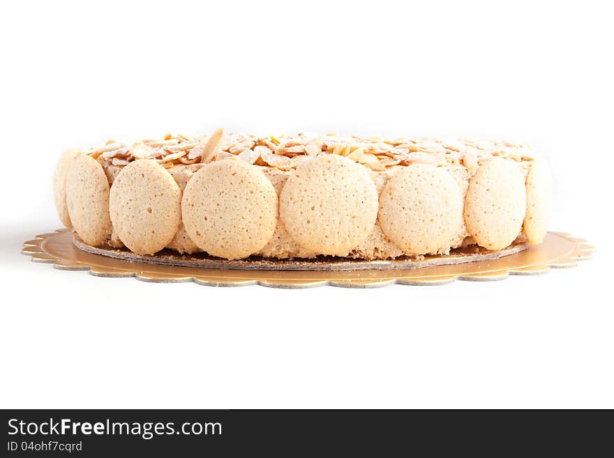 Nuts cake with macaroons on white