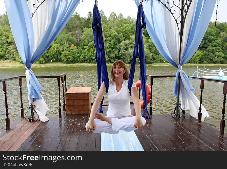 Female aerial yoga relaxing