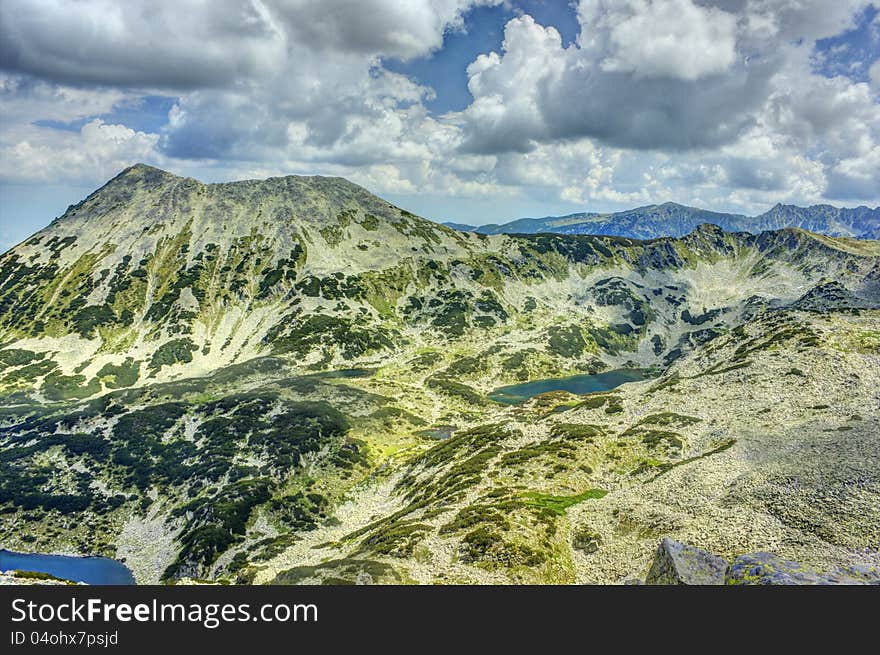 A beautiful high mountain landscape with Todorka peak from Pirin mountain in Bulgaria. A beautiful high mountain landscape with Todorka peak from Pirin mountain in Bulgaria