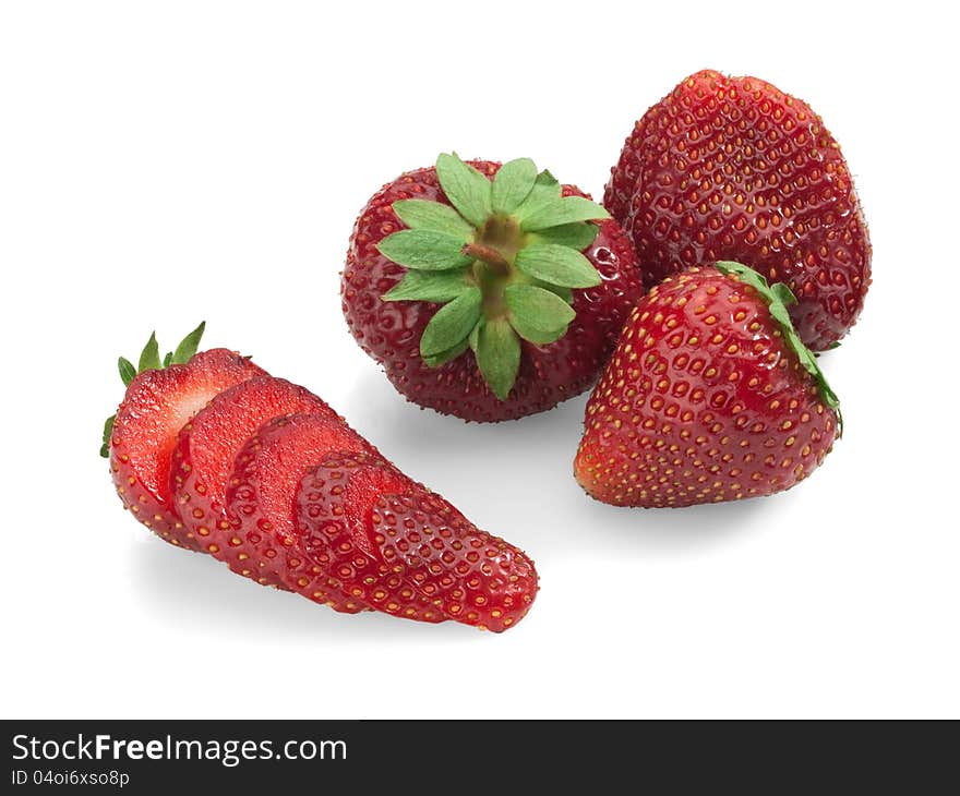 Strawberry whole and in slices on a white background. Strawberry whole and in slices on a white background.