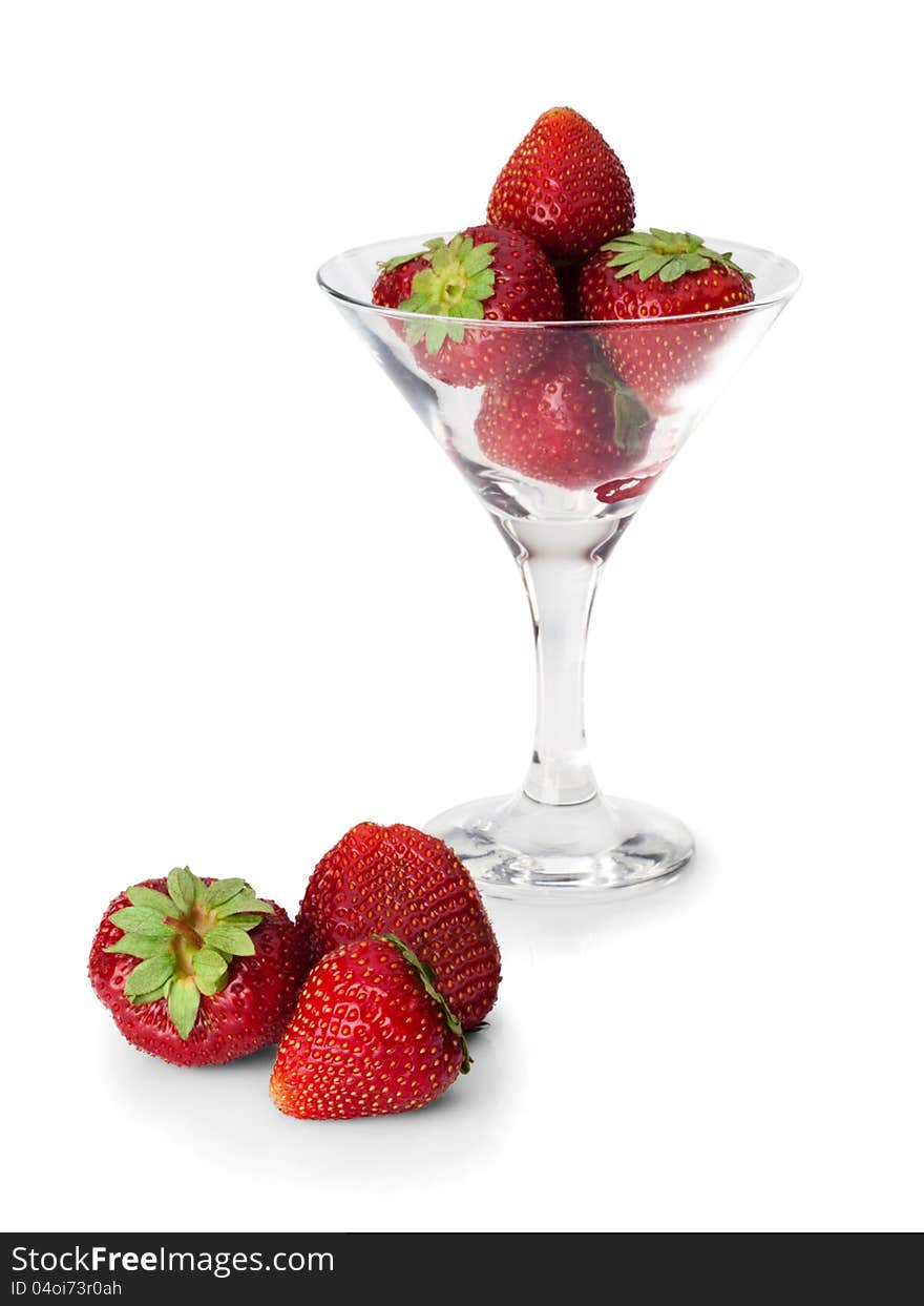 Strawberry in a glass and near to it on a white background. Strawberry in a glass and near to it on a white background.