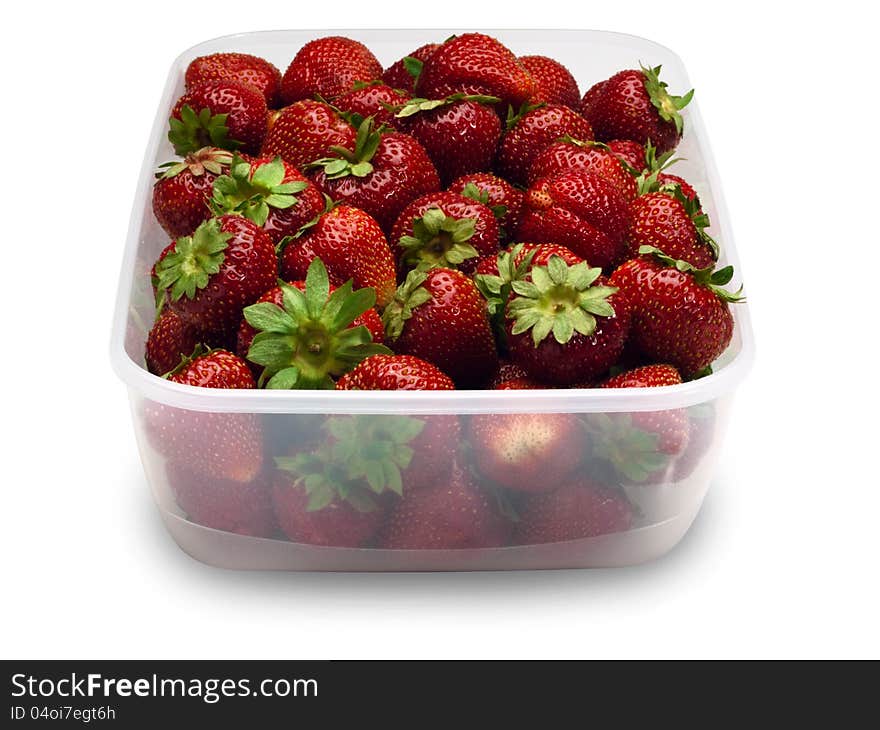 Strawberry in plastic packing on a white background. Strawberry in plastic packing on a white background.