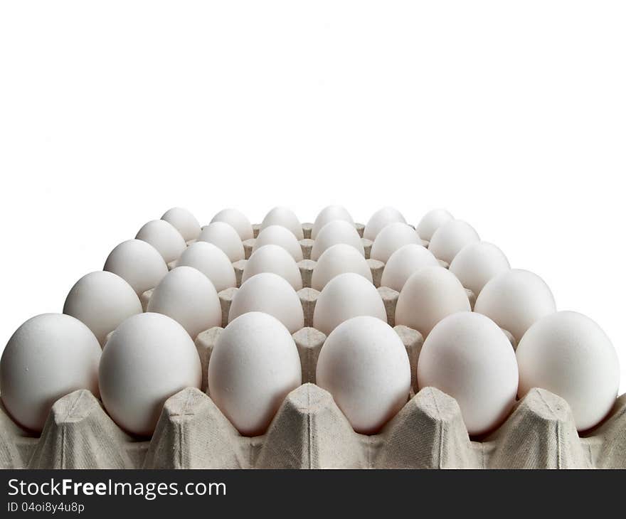 Eggs of a hen in packing on a white background.