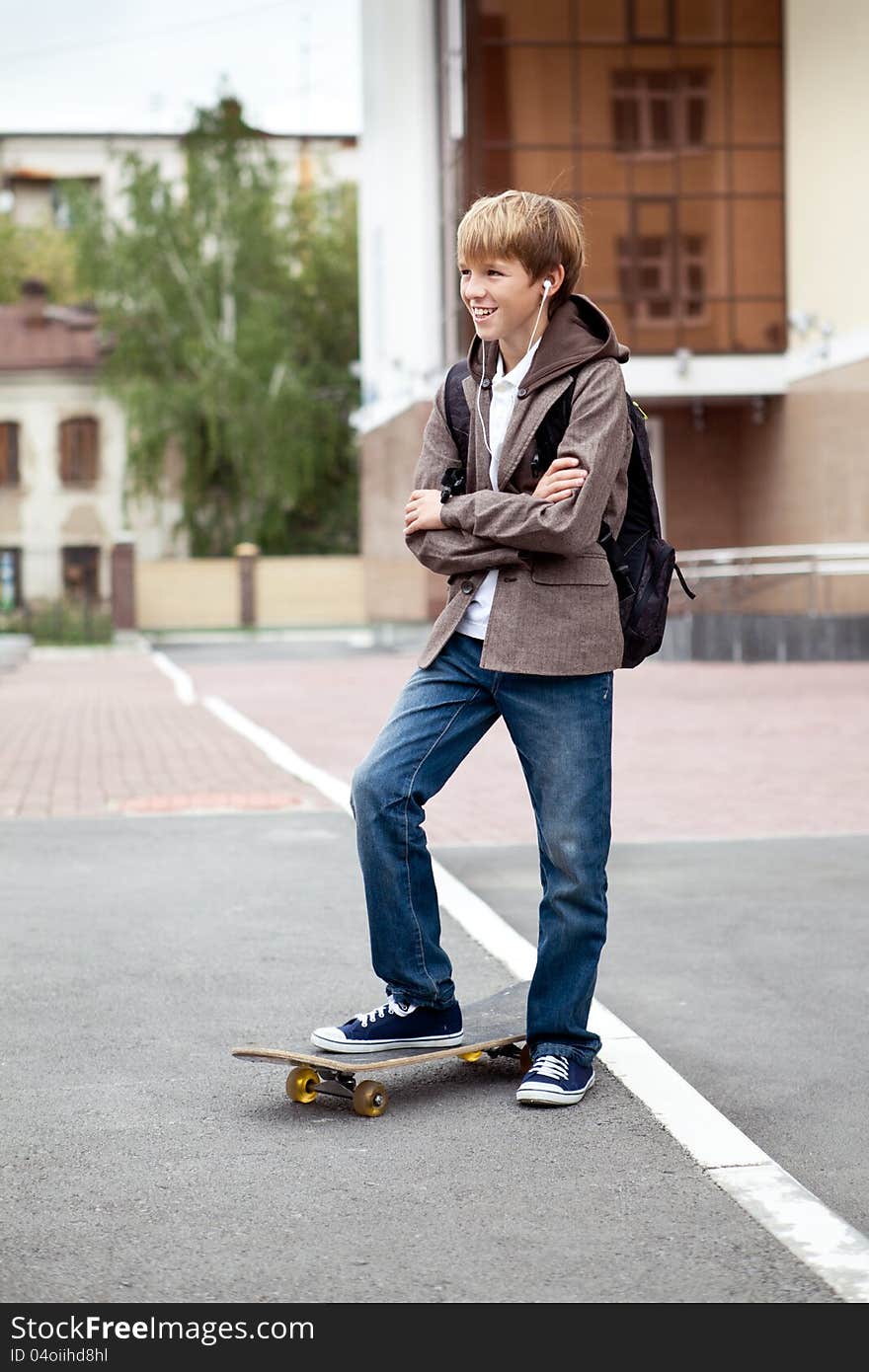 School Teen With Schoolbag And Skateboard