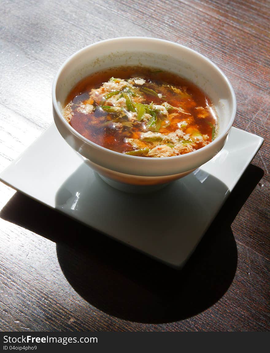 Plate of soup on tha table. macro