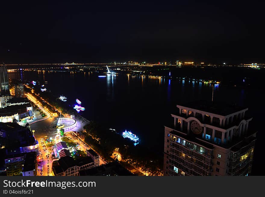 This image was taken from the top of an apartment and show Harbin, China illuminated at night. This image was taken from the top of an apartment and show Harbin, China illuminated at night.