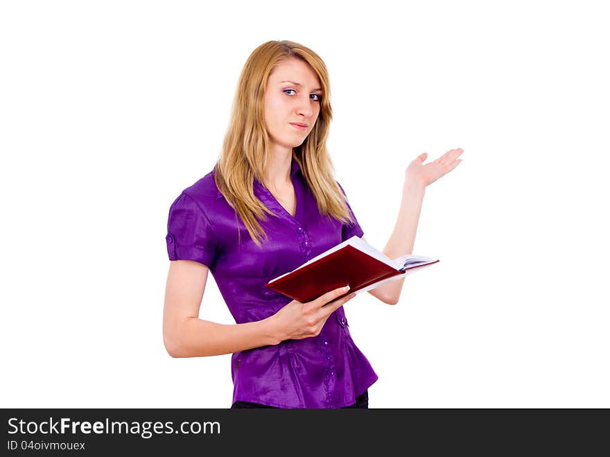 The girl keeps a book and indicates isolated on white background