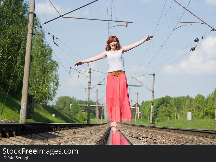 Beautiful Girl Standing On The Rails