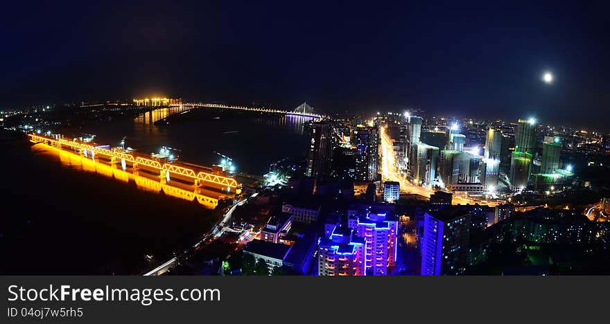 This image was taken from the top of an apartment and show Harbin, China illuminated at night. This image was taken from the top of an apartment and show Harbin, China illuminated at night.