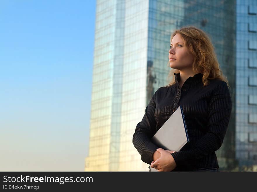 Young businesswomen holding laptop. It's her internet business, and she is successful businesswomen. Young businesswomen holding laptop. It's her internet business, and she is successful businesswomen