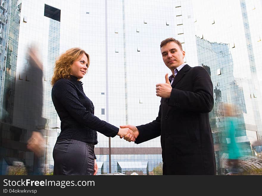 Successful business team striking a bargain (deal). Two business people shaking hands. Successful business team striking a bargain (deal). Two business people shaking hands