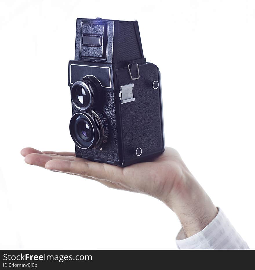 Hand with retro camera