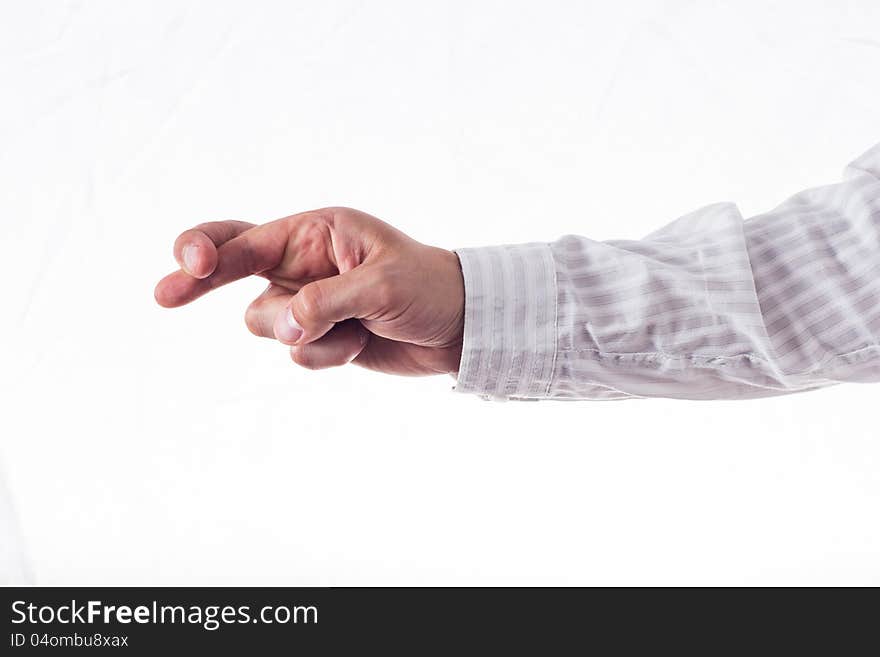 Hand with crossed fingers in striped shirt, isolated on white.