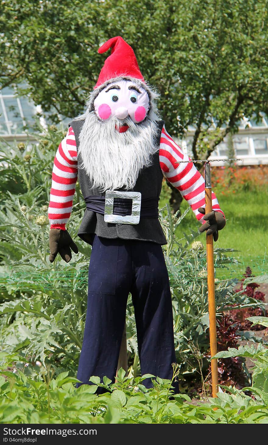 A Scarecrow Dressed as a Gardening Gnome. A Scarecrow Dressed as a Gardening Gnome.