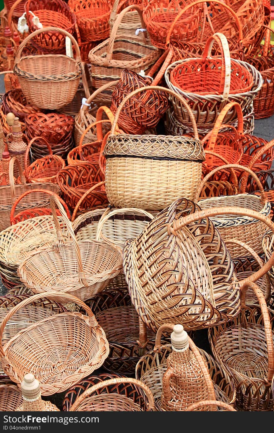 Many beautiful wooden wicker baskets close-up