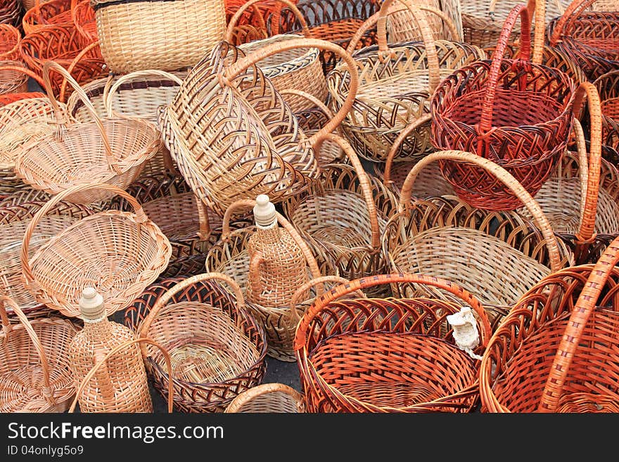 Many beautiful wooden wicker baskets close-up