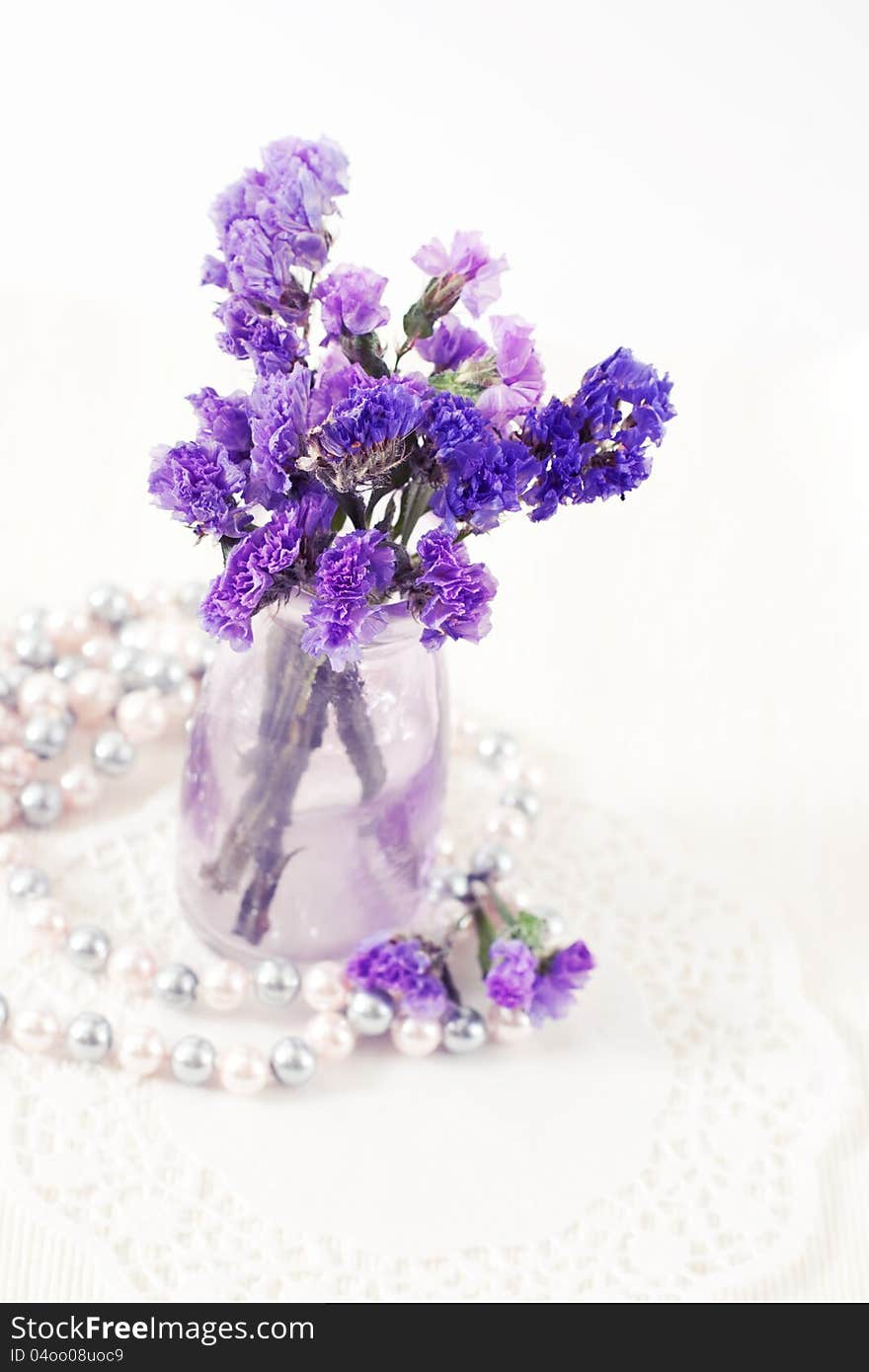 Still life with purple flowers