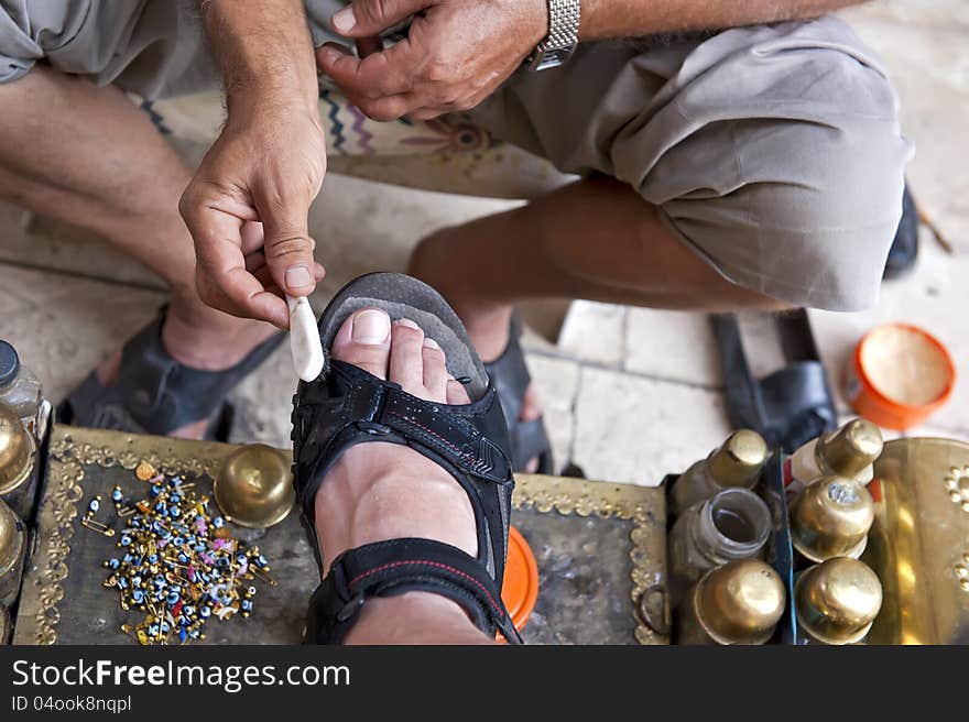 Turkish bootblack at work