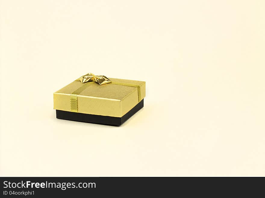 Fine image of isolated gift box with golden ribbon. Fine image of isolated gift box with golden ribbon