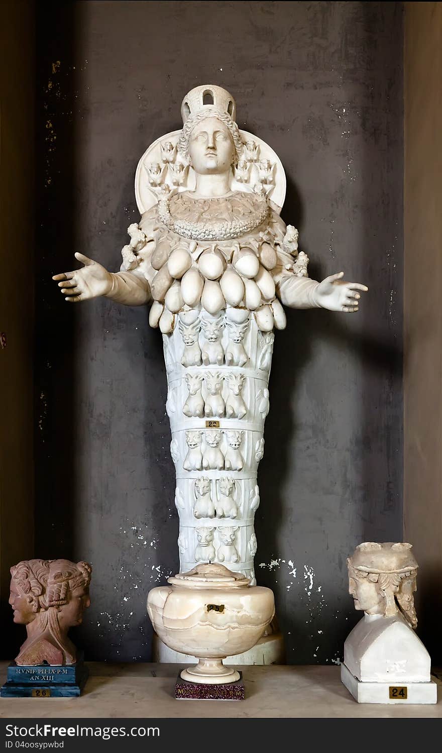 Statue of the Ephesian Artemis, crowned and decorated with multiple egg-shaped breasts.