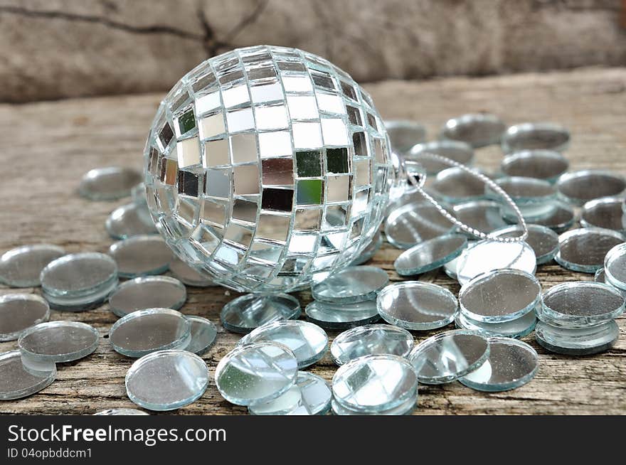 Mirror christmas ball on wooden background