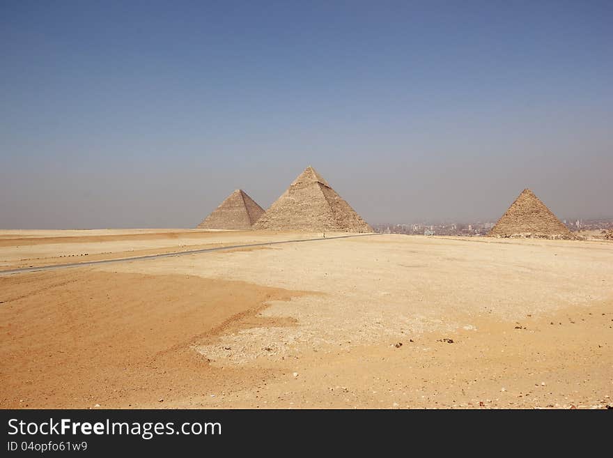 The Giza Necropolis is an archaeological site on the Giza Plateau, on the outskirts of Cairo, Egypt. This complex of ancient monuments includes the three pyramid complexes known as the Great Pyramids. The Giza Necropolis is an archaeological site on the Giza Plateau, on the outskirts of Cairo, Egypt. This complex of ancient monuments includes the three pyramid complexes known as the Great Pyramids.