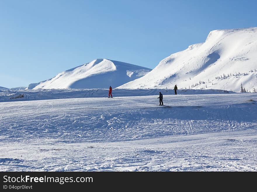 Skiers in a high mountains