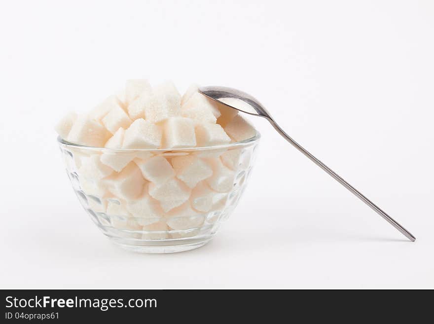 Cubes of sugar on the white background