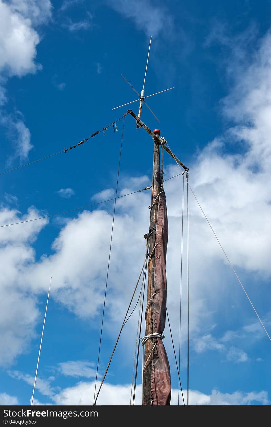 Foresail, Jib, and Wooden Mast of a sailing yacht