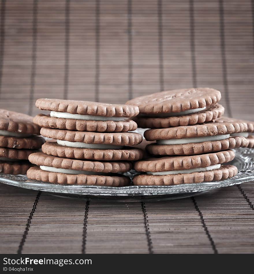 Chocolate cookies filled with white cream