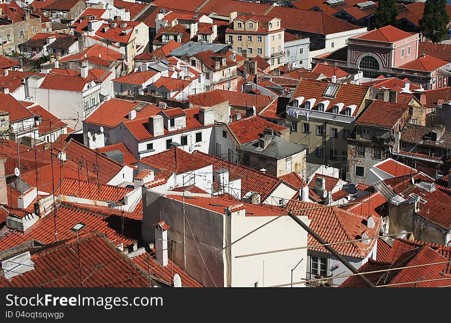 Red rooftops in the Portuguese capital Lisbon. Shot from a high viewpoint. Red rooftops in the Portuguese capital Lisbon. Shot from a high viewpoint