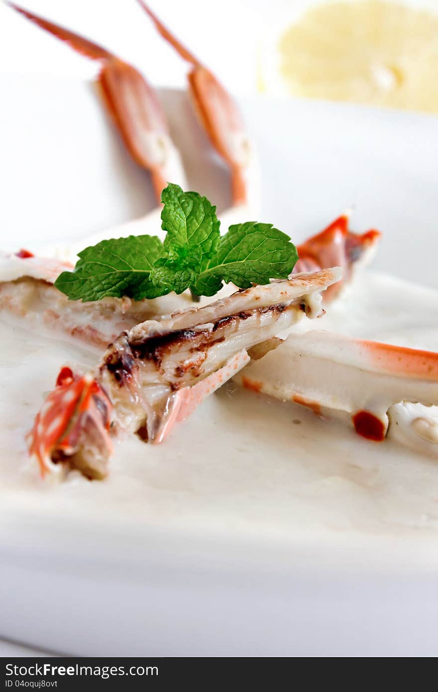 Crab soup served with fresh mint in a white bowl. Crab soup served with fresh mint in a white bowl.