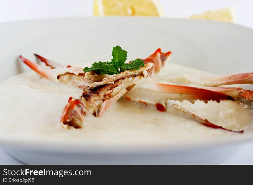 Crab soup with whole claw in the plate. Crab soup with whole claw in the plate.